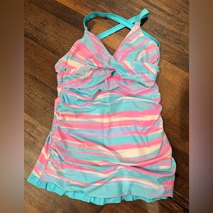 Vibrant Striped skirted swimsuit with ruffles along the bottom.